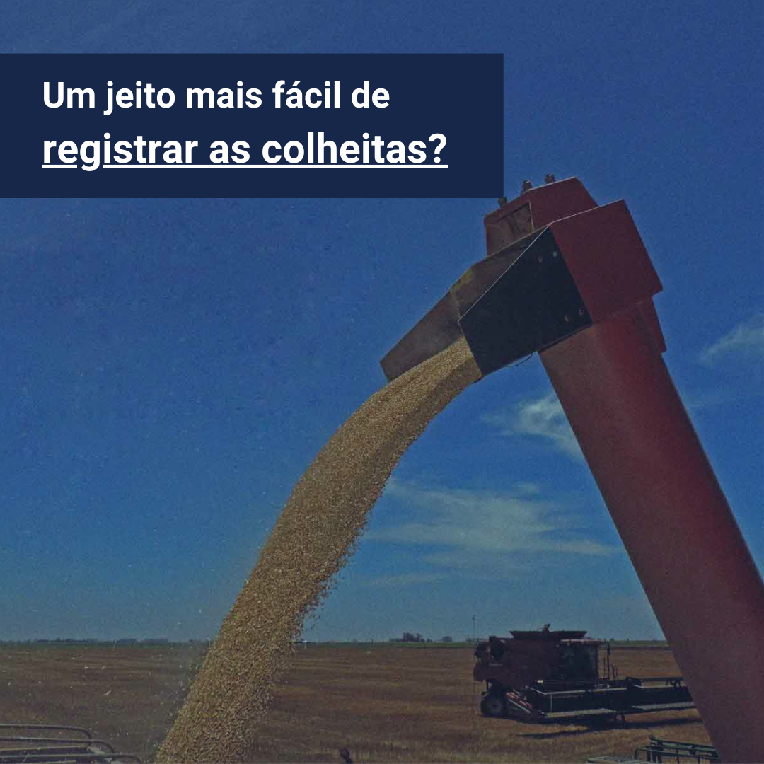 Foto de uma colheitadeira descarregando grãos em um caminhão